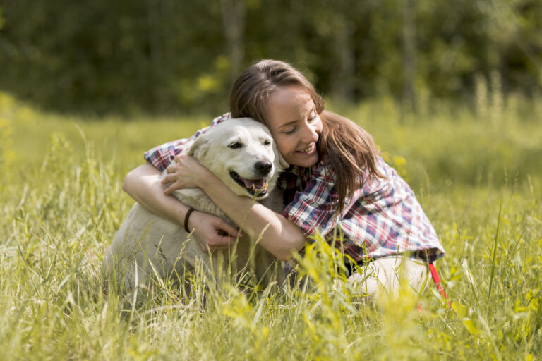 woman-enjoying-with-dog-countryside